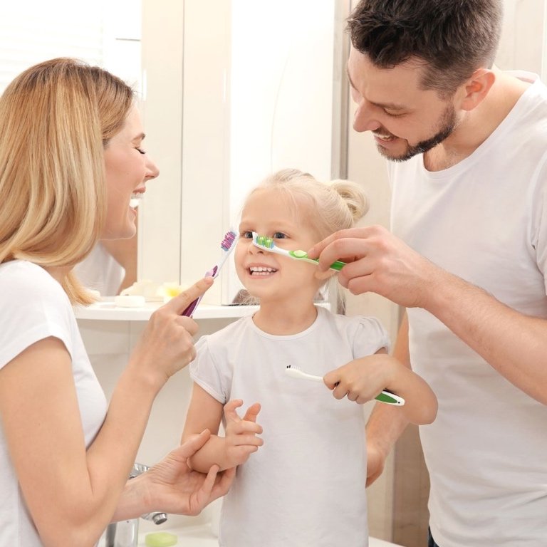 Ensuring Natural Health for Her Family A caring parent smiling with her children, showcasing natural health