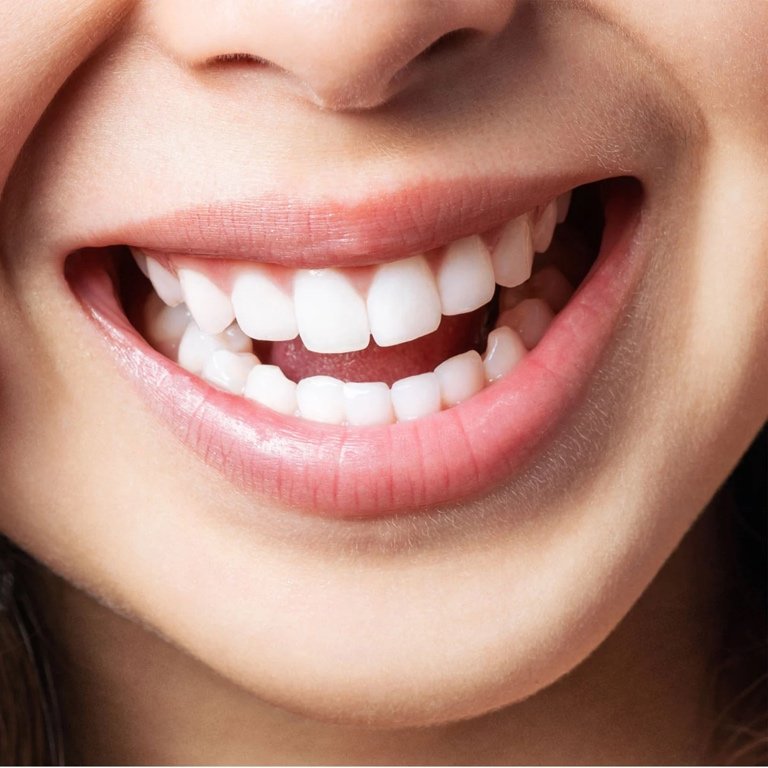 Discovering Value in Natural Dental Care A thoughtful individual exploring dental care choices with a hopeful look